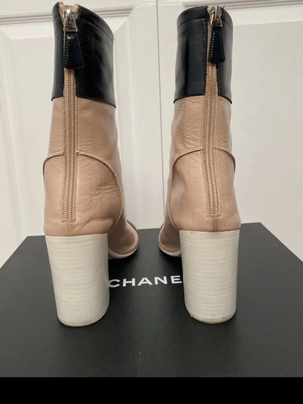 CHANEL Two-Toned Leather Cap-Toe Block Heel Ankle Boots in Beige & Black